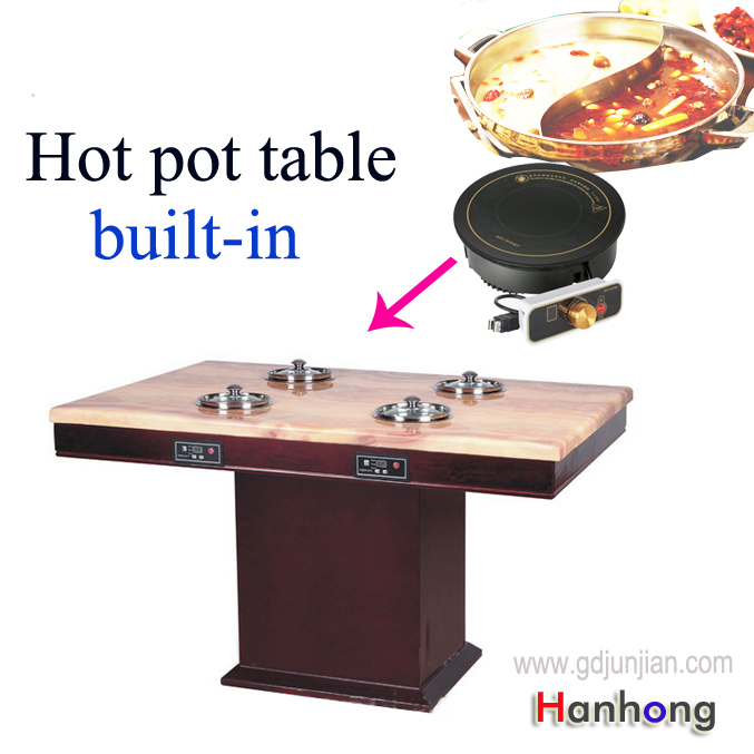 table with induction cooktop for restaurant